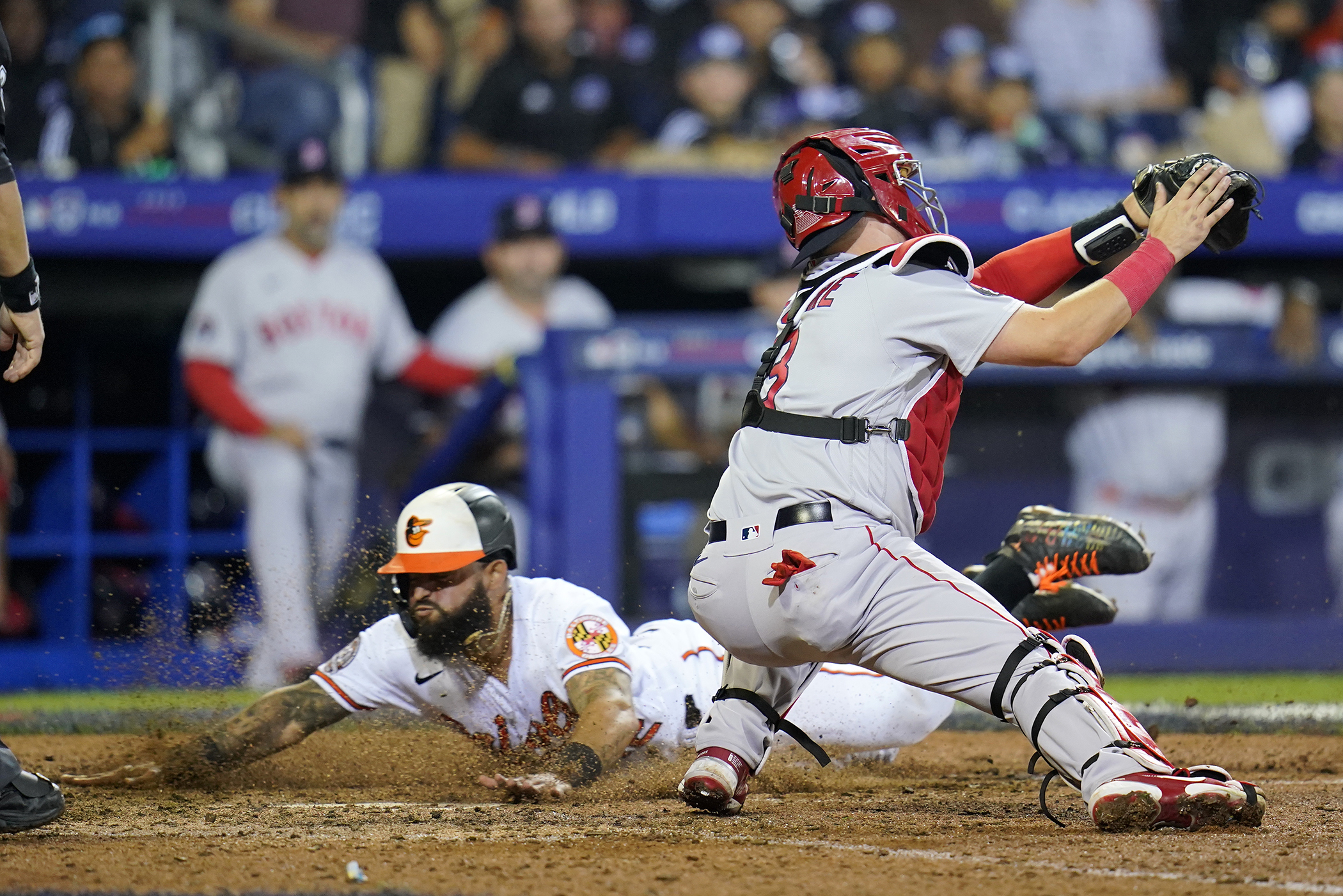 A Little Leaguer sitting behind home plate at Red Sox-Orioles had a...