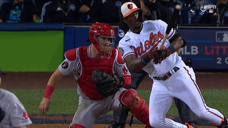 A Little Leaguer sitting behind home plate at Red Sox-Orioles had a...